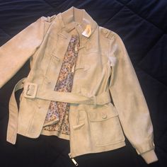 Belted Bomber Jacket From Forever 21, Never Been Worn. Still Has The Tags And Spare Button. Floral Lining, Soft Material That Mimics Suede. Make Me An Offer! Spring Collared Outerwear With Double Button Closure, Spring Collared Belted Outerwear, Trendy Spring Blazer With Buttons, Spring Collared Outerwear With Button Closure, Spring Casual Blazer With Button Closure, Trendy Khaki Outerwear With Snap Buttons, Casual Spring Blazer With Double Button Closure, Spring Belted Button-up Outerwear, Trendy Fitted Outerwear With Double Button Closure