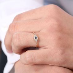 Made to Order
Gold Kt: 14K
Available Gold Color: Rose Gold, Yellow Gold, White Gold
Round Diamond: 12 Pcs 1.2MM
Round Sapphire: 1 Pcs 2.2MM
Total Diamond ctw: 0.12 ctw
Total Sapphire ctw: 0.05 ctw
Diamond Color-Clarity: G Color SI Clarity


The eye is a doorway to light and life. It is a symbol of spirit, awakening, enlightenment, rebirth, and potential. Measure Ring Size, Round Sapphire, Evil Eye Ring, Eye Ring, Light Of Life, Local Jewelry, Favorite Rings, Eternity Bands, Diamond Gemstone