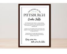 the history of the pittsburg cookie table printable is displayed in front of a wooden frame