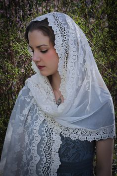 A veil in honor of Our Lady of Guadalupe. An incredibly soft veil. This is a lovely and soft fabric, strewn with lovely embroidered flowers. The delicate flowers are scattered over the entire veil, and the edge is scalloped gently around the face. Finished with an intricate Venice trim at the hem. Wrap it in several ways, or wear it down, and as a shawl. This generously-sized tapered rectangle veil measures about 70 x 24 inches. Evintage veils are handmade in limited production; not mass produce Elegant Wedding Dupatta With Lace Trim, Elegant Dupatta For Wedding, Elegant Dupatta For Marriage, Elegant White Dupatta For Marriage, Cream Lace Wedding Veil, White Bohemian Wedding Dupatta, White Bohemian Dupatta For Wedding, Bohemian White Dupatta For Wedding, Vintage Lace Wedding Veil