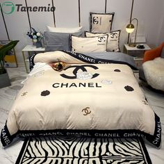 a chanel bed set with zebra print on it