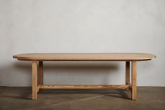 a wooden table sitting on top of a cement floor