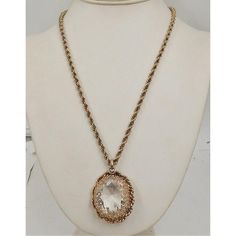 This is part of Chairish’s Costume Jewelry assortment.  1950s goldtone filigree large faceted unfoiled open-backed clear rhinestone pendant necklace with security clasp. Marked "Napier" on a jump ring near the clasp. Pendant measures:  1 3/4 inches long by 1 3/8 inches wide. Chain doubled is 10 1/2 inches long. Excellent condition. The matching earrings are shown on pg. 212 of Melinda L. Lewis & Henry Swen's book "The Napier Co.: Defining 20th Century American Costume Jewelry." Vintage Crystal Pendant Jewelry, Antique Gold Crystal Jewelry, Victorian Gold Faceted Jewelry, Gold Vintage Rhinestone Necklace, American Costume, Modern Branding, Accessories Jewelry Necklace, Clear Rhinestones, Jump Rings