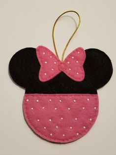 a minnie mouse ornament hanging on a wall