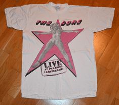 1980's THE CURE tee shirt  Size: Medium Brand: Unknown Material: 100% cotton  Chest: 20 inches  (measured across the shirt from armpit to armpit) Length: 26.5 inches  (measured from top to bottom starting at the back collar) Condition: EXCELLENT vintage condition w/ no holes but has some light storage marks that may wash out  **Any reasonable offers will be considered** DOMESTIC SHIPPING   $0.00  FREE INTERNATIONAL SHIPPING  $20.00 Canada $25.00 Rest of the World I have an enormous vintage tee shirt collection, so if you are looking for any specific feel free to toss me an email.. Enjoy!! Vintage T Shirt Aesthetic, 80s T Shirts Vintage Tees, Vintage Band Tshirt, Vintage Summer Shirt, Vintage T Shirts 70s, Rock Tshirts, 80s Band Tees, Vintage Graphic T Shirt, Vintage Tshirt Design