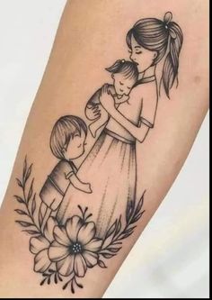 a woman holding a small child on her arm with flowers around it and the word mom written