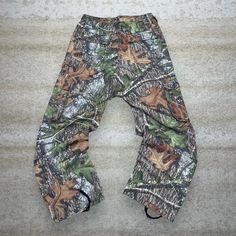 Vintage Mossy Oak Hunting Camo Tactical Pants Baggy Fit Cargos Crazy Woodland Pattern 90s Skate / Streetwear Great Condition: 9/10 Men's Size:  Waist: 32" Length (inseam): 32" Leg Opening: 9.5" Thigh Opening: 13" Front Rise: 13.5" Baggy Cargo Pants For Outdoor, Baggy Cargo Trousers For Outdoor, Hip Hop Style Baggy Cargo Jeans For Outdoor, Baggy Hip Hop Cargo Jeans For Outdoor, Hip Hop Bottoms With Cargo Pockets For Outdoor, Camouflage Cargo Pants For Outdoor, Military Style Baggy Cargo Pants For Outdoor Activities, Military Style Baggy Pants For Outdoor Activities, Hip Hop Khaki Bottoms For Outdoor Wear