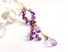 "One of a kind, precious amethyst with a dramatic deep purple hue lariat necklace. Enjoy the unique beauty of its elegant lariat design, crafted carefully to last for years to come. This necklace is sure to make a lasting impression. Video is shown how to wear like this lariat necklace ● Material 14K gold filled  ● Gemstone Amethyst - royal purple amethyst, pink amethyst , light amethyst  ● The length of the pendant is 2.5\"  (6.4cm) includes dangling beads, Teardrop size 17mm to 18mm ● Chain 18 Elegant Purple Wire Wrapped Jewelry, Elegant Amethyst Wire Wrapped Necklaces, Elegant Wire Wrapped Amethyst Necklace, Elegant Amethyst Jewelry With Adjustable Chain, Elegant Amethyst Wire Wrapped Necklace, Elegant Purple Amethyst Drop Necklace, Elegant Lavender Drop Necklaces, Elegant Amethyst Dangle Necklaces, Elegant Purple Dangle Necklaces