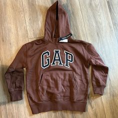 Brand New Gap Hopdie Fits A Woman’s Size Small Or Xs Gap Sporty Sweatshirt For Fall, Gap Sweatshirt With Letter Print For Streetwear, Sporty Gap Hoodie For Fall, Gap Hoodie With Adjustable Hood For Streetwear, Gap Hoodie With Letter Print For Fall, Fall Hooded Top With Logo Print, Gap Sweatshirt With Adjustable Hood For Streetwear, Gap Hooded Hoodie For Fall, Gap Hoodie With Letter Print For Streetwear