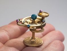 We combine shipping for your order. Each additional item from our store adds $0 to the shipping cost: https://paperdiorama.etsy.com YOU WILL GET: Dollhouse artisan astrolabe astronomical with planets. You will receive a disassembled kit (either painted to match the picture or left unpainted in a random color), you will need to assemble and glue it by yourself PAYMENT AND SHIPPING: We ship worldwide via posta.rs with insurance and tracking number Our store accepts payments via PayPal, which is the safest way to pay for your order HOW TO USE: - Handle with care: Collectible doll miniatures are fragile and should be handled with caution to avoid damage - Keep out of reach of children: These miniatures are not designed for children to play with and should be kept in a secure location where chi White Doll House, Glass Shadow Box, Miniature Snowman, Diy Accessory, Mini Things, Dollhouse Accessories, Dollhouse Dolls, Miniature Toys, Vintage Tin