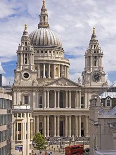 the dome of st paul's cathedral in london is seen from across the street