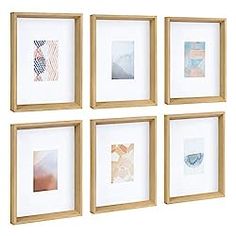 four wooden frames are hanging on the wall