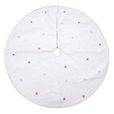 a round white tablecloth with pink stars on the top and bottom, in front of a white background