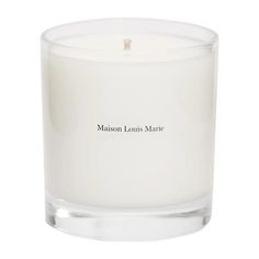 a white candle with the words madison louis marie on it's front and side