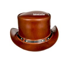 Leather Top Hat SR2 Band Style Brown Top Hat Handmade with 100% Cowhide Leather Gift for him New with Tags Description: * High-Quality Craftsmanship handmade * Real Leather * 100% pure leather **Those living in remote areas will have to pay $45 extra as shipping charges before the item is shipped. Sizing: Heads come in all sizes, and in a lots variety of shapes. Although high quality hats are adaptable, and will usually conform to differences in shape with a little wearing, it is essential that the size be correct for the head. To determine your hat size, measure the circumference around your head, keeping the tape level and firm, across the temples and above the eyebrow ridges. Check the size chart given below. For in-between measurements use the next size up. Hat Care: Any scratches or m Australian Cowboy Hat, Leather Top Hat, Brown Cowboy Hat, Leather Cowboy Hats, Steampunk Top Hat, Brown Top, Quality Hats, Leather Gifts, Cool Hats