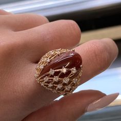 This Beautiful Cocktail Ring Is Crafted In 18k Rose Gold And Features A Large Natural Pear Shape Red Agate Gemstone Weighing 1.80 Grams And Round Brilliant Cut Diamonds Weighing 1.22cttw. Diamond Color G And Vvs Clarity. Ring Size 7.75. Top Measurements: 23.00mm. Comes With The Original Box And A Certificate. Id: 048324 Luxury Diamond Cabochon Gemstones, Luxury Diamond Gemstones With Cabochon Cut, Luxury Ruby Cabochon Diamond Ring, Luxury Ruby Ring With Diamond Accents, Luxury Ruby Ring With Gemstone Accents, Luxury Cabochon Diamond Ring As Gift, Luxury Rose Gold Diamond Ring With Gemstone, Luxury Carnelian Jewelry For Formal Occasions, Elegant Carnelian Ring In Yellow Gold