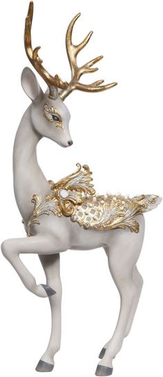 a white and gold deer figurine with antlers on it's back