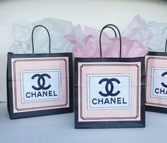 three bags with chanel logos on them