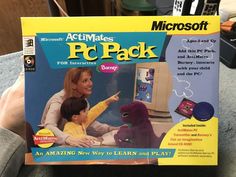 a person holding up a book about pc pack