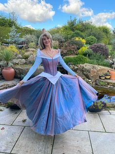 a woman in a blue and purple dress