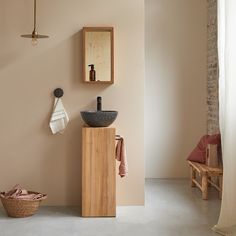 the bathroom is clean and ready for us to use it's natural wood accents