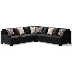 a black sectional couch with pillows on it's back and side facing each other