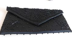 Gorgeous Black Beaded evening clutch with black satin lining was made in Japan. The inside is lined with satin with an inside pocket. The clutch has a snap closure. The inside and out is in pristine condition. Measures 9 1/2" X 5". Great accessory for an up and coming Grad or Wedding! Black Beaded Formal Evening Bag, Black Envelope Evening Bag For Formal Occasions, Black Envelope Evening Bag For Party, Satin Clutch, Satin Noir, Clutch Black, Gold Flecks, Beaded Clutch, Evening Clutch