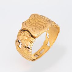 Finely detailed antique Victorian shield signet ring (circa 1880s to 1900s), crafted in 18 karat yellow gold.   The centre shield is engraved with the initials "FH".   The side shoulders feature a pretty floral design, terminating to the shield mount. The saddle of the ring is low and curves to the shape of the finger.     The ring is in good condition with patina and wear evident. We have not cleaned the ring in order to preserve the patina and collector value.    Particulars:  Weight: 6.6 gram Victorian Yellow Gold Initial Ring, Victorian Yellow Gold Signet Ring With Initials, Gold Victorian Signet Ring With Maker's Mark, Victorian Gold Signet Ring With Maker's Mark, Victorian Engraved Ring With Initials, Victorian 14k Gold Engraved Ring For Ceremonial Occasions, Victorian Gold Signet Ring With Initials, Heirloom Signet Ring With Intricate Design, Vintage Engraved Ring With Historical Design For Ceremonial Use