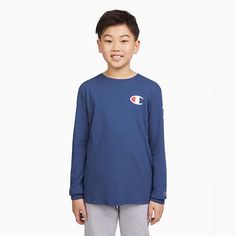 Every boy needs a long-sleeve graphic tee in his wardrobe. This one features a logo sleeve detail so he can showcase his Champion pride. This tee will seamlessly take him from school to practice.Closure Type: Pullover HeadFit: Classic FitNeckline: Crew NeckSleeve Length: Long SleeveFiber Content: 60% Cotton, 40% PolyesterFabric Description: JerseyCare: Machine Wash, Tumble DryCountry of Origin: Imported Sleeve Detail, Big Boys, Kids Boys, Long Sleeve T Shirt, Kids Tshirts, Graphic Tee, Shirts Tops, Long Sleeve Tshirt, Graphic Tees