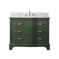 a bathroom vanity with marble top and gold handles on the drawers, in green color