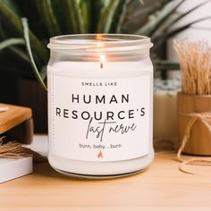 a candle sitting on top of a wooden table