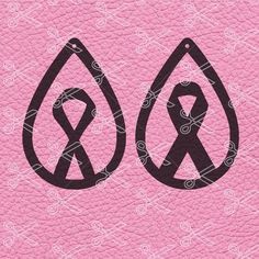 an image of a pair of scissors in the shape of tears on a pink leather background