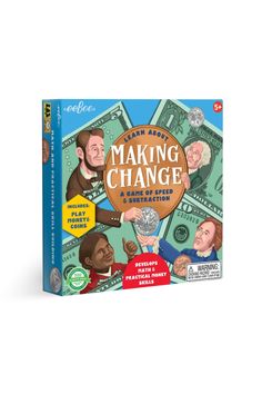 a book on making change is sitting on top of a wooden table next to a pile of money