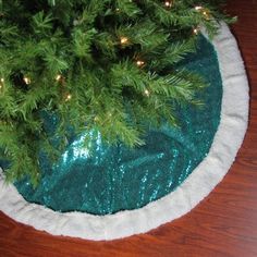 a christmas tree skirt on top of a wooden table