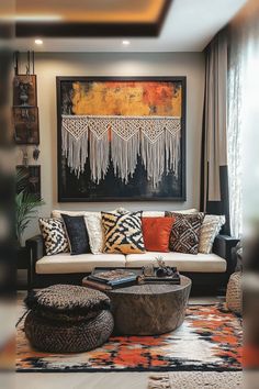 a living room filled with furniture next to a painting on the wall in front of a window