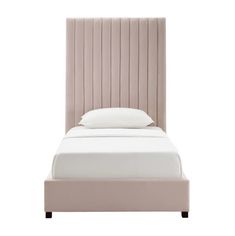 an upholstered bed with white sheets and pillows on top of it's headboard