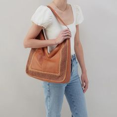 Channel your boho side with the Daisy Hobo. It's all in the details. This super soft leather paired with beautiful crochet is '70s-inspired perfection. Details: 15" W X 16" H X 3" D Unlined N/A Fits your phone and small tablet N/A Hidden Magnet Closure 11.5" Strap Drop Solid leather single strap Cooler Lunch Bag, Wedge Flip Flops, Nautical Jewelry, Shopping Event, Meaningful Jewelry, 70s Inspired, Handbag Straps, Beautiful Crochet, The Details