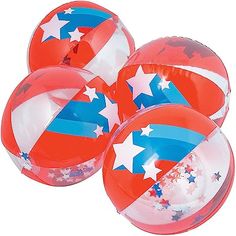 three red, white and blue balls with stars on them are in the shape of an american flag