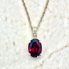 14K Gold Diamond & Garnet Pendant Necklace - 14K Yellow Gold Oval Garnet Necklace - January Birthstone Necklace - Best Birthday Gift For Her Beautiful and classic 14 karat yellow gold pendant necklace featuring a natural 8x6 mm oval garnet the birthstone for January!  The gemstone weighs approximately 1.50 carat.  It is accented with 4 diamonds weighing approximately 0.02 carat.  The pendant comes with a lightweight 14 karat yellow gold rope chain.  The chain measures 18 inches and is 0.90 mm th Oval Gemstone Birthstone Necklace For Formal Occasions, Oval Birthstone Necklace For Anniversary, Anniversary Birthstone Necklace With Oval Pendant, Anniversary Oval Pendant Birthstone Necklace, Oval Gemstone Birthstone Necklace For Anniversary, January Birthstone Necklace, Smoky Quartz Jewelry, Gemstone Rings Vintage, December Birthstone Jewelry