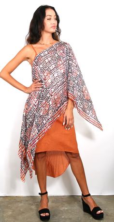 Our best seller know as our “ Poncho” is a very easy to wear shape. It has open sides, a neckline in the center and can be worn many ways and is the ESSENTIAL Travel Must have item! The poncho can be worn many ways such as shown, or as a scarf, wrap around your hip, one shoulder over a dress, and has many multi functions (see chart of many ways to wear). It’s the must have beach cover up and also looks great over jeans. We suggest you wear it on the plane to keep warm while traveling and this wa Chic Summer Poncho In Cape Style, Bohemian Cape Shawl For Summer, Bohemian Shawl Cape For Summer, Bohemian Summer Cape One Size, Chic Summer Cape Poncho, One Size Shawl Cape For Summer, Bohemian Summer Cape Shawl, Bohemian One-size Cape For Summer, Free Size Poncho For Beach Cover-up In Summer