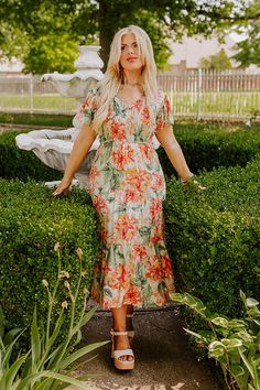 - Sip your sangria under the sun in this fabulous dress! - Lightweight material with green, orange, pink and purple hued floral print - A built-in skirt lining - A v-cut neckline - A smocked bodice - Short flutter sleeves - A flowy yet flattering silhouette that ends in a midi length hemline Measurements 1XL : Bust 36", Hip 42", Length 48.5", Sleeve Length 6.5", Waist 34". 2XL : Bust 38", Hip 44", Length 49", Sleeve Length 6.5", Waist 36". 3XL : Bust 40", Hip 46", Length 49.5", Sleeve Length 7", Fabulous Dress, Skirt Lining, Fabulous Dresses, Purple Hues, V Cut, V Cuts, Pink And Purple, Flutter Sleeves, Floral Midi Dress