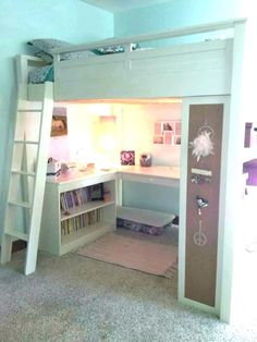 there is a loft bed with a desk and bookshelf in the room,