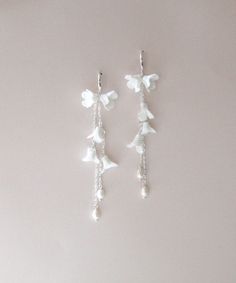 Our Long Floral Bridal Earrings feature freshwater pearls and are perfect for any special occasion. Crafted from durable materials, the pearls offer a delightful finishing touch. - Handcrafted with clay flowers, freshwater pearls - Available in rose gold, yellow gold or bright silver - Earrings measure 4.25 inches long - Nickel free and hypoallergenic Matching pieces: https://www.etsy.com/listing/1584210790/floral-bridal-bracelet-rose-gold?click_key=ec22bdc856b2549a597563b442abddca675f02cd%3A158 Bracelet Rose Gold, Freshwater Pearls Earrings, Bridal Bracelet, Clay Flowers, Floral Bridal, Long Earrings, Wedding Earrings, Bridal Earrings, Beautiful Earrings