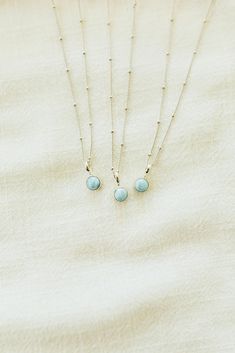 Larimar stone is one of our favorites because it is only found in the Dominican Republic. Each stone resembles the ocean through it's white and blue mixed colors. Silver Material White Gold-Plated 100% Sterling Silver Base Nickel free Hypoallergenic Pearl Clasp 18" Chain 2" Extender Tarnish Resistant Water Resistant Luxury Elegant Larimar Jewelry, Round Turquoise Aquamarine Necklace, Turquoise Aquamarine Round Necklace, Turquoise Aquamarine Necklace, Adjustable Turquoise Necklace As A Gift, Adjustable Turquoise Necklace For Gift, Adjustable Light Blue Turquoise Necklace Gift, Hypoallergenic Amazonite Jewelry As Gift, Blue Larimar Jewelry With Gemstone Beads