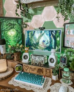 there is a computer on the desk with many decorations around it and plants in pots