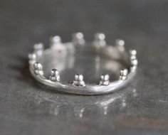 This dainty little crown ring is in fantastic pre loved condition, only very slightly oxidised by time. Roughly 16 mm inner diameter and according to the Wikipedia that makes it a US size 5 1/2, and a UK size K. Stamped inside 925 for sterling silver, quite light and comfortable to wear. For more vintage and antique rings: https://www.etsy.com/uk/shop/Meanglean?ref=seller-platform-mcnav&search_query=ring Back to shop: https://www.etsy.com/uk/shop/Meanglean?ref=si_shop Crown Rings, Vintage Tiara, Tiara Ring, Crown Ring, Oxidised Jewellery, Tiaras And Crowns, Antique Rings, Vintage Boho, Silver Band