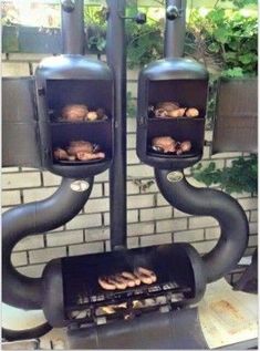 an outdoor grill with donuts cooking on it