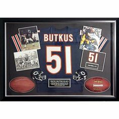 an autographed football and other memorabilia is displayed in a black framed display case