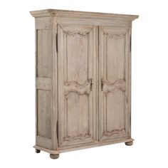 an old wooden armoire with carvings on the front and sides, isolated against a white background