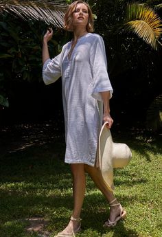 Eco friendly caftans and tunics inspired by the ocean, made on main street. Ethically sourced and locally made in Los Angeles. You asked, we delivered: A short version of our popular double gauze tunic dress. Simple, pared down, and easy, this is the ultimate 'throw-on-and-go' dress. Made in our soft, double gauze fabric, it drapes as beautifully as it launders. (It's hard to believe, but it gets softer and softer with each wash, and, it won't shrink). With pockets and a classic v neckline, this Daywear Relaxed Fit Tunic With Split Neck, Relaxed Fit Split Neck Tunic For Daywear, Casual Summer Tunic With Split Neck, Spring Tunic Beach Dress In Relaxed Fit, Spring Tunic Beach Dress Relaxed Fit, Bohemian Tunic For Daywear With Relaxed Fit, Bohemian Tunic With Relaxed Fit For Daywear, Oversized Linen Beach Dress For Summer, Relaxed Fit Tunic For Beach In Spring